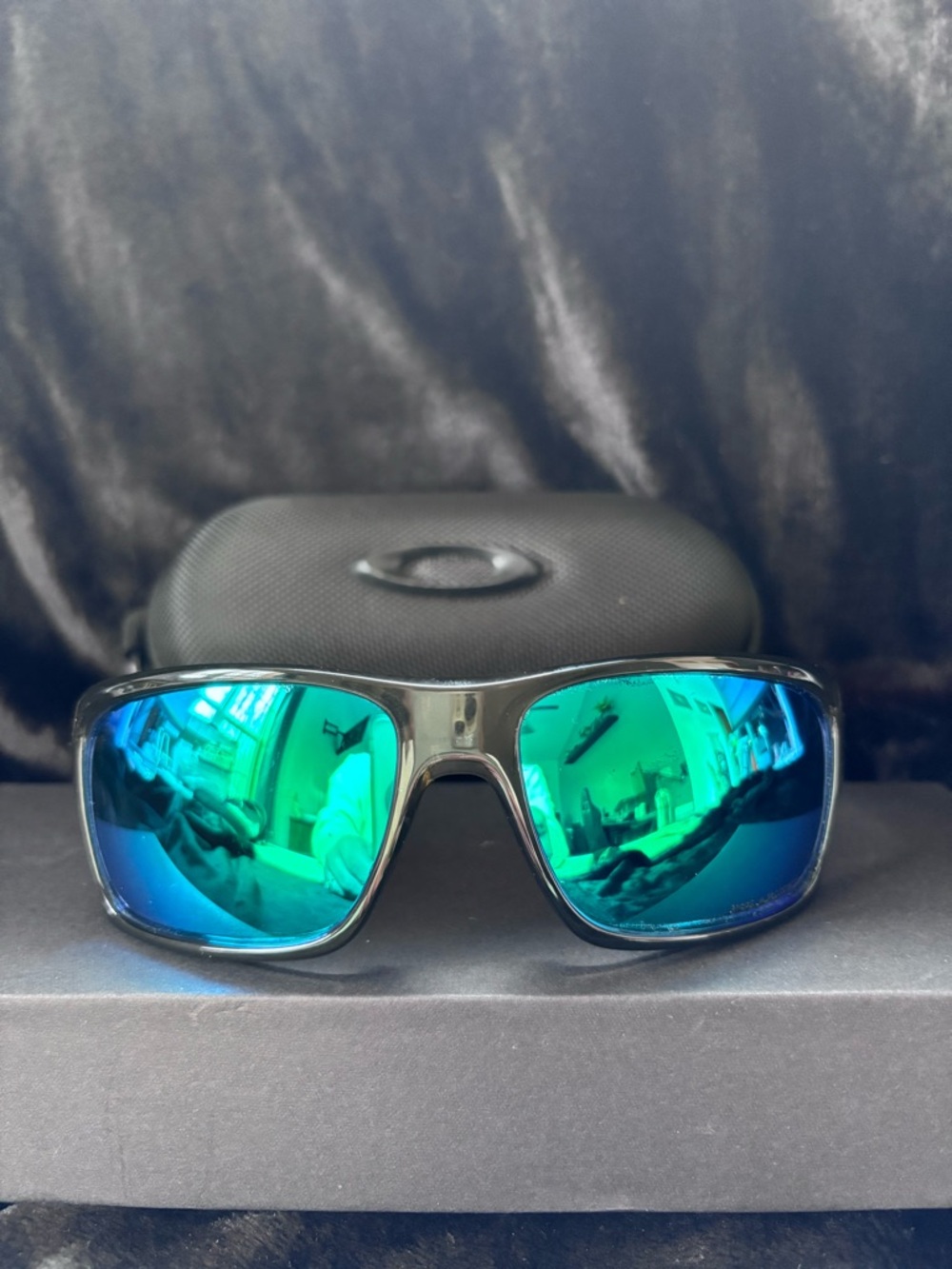 Oakley Black Frame Sunglasses with Blue-Green Mirror Lenses
